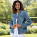Woman wearing a blue denim jacket on a white background